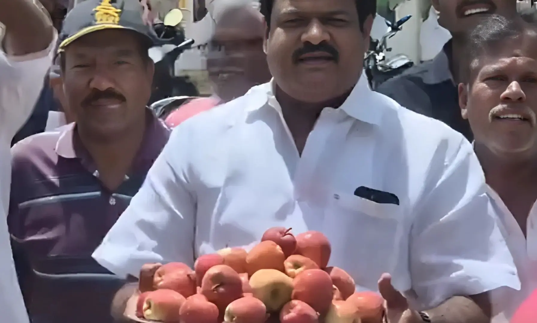Congress leader L Rex distributing Kashmiri apples | Photo: ANI (X)