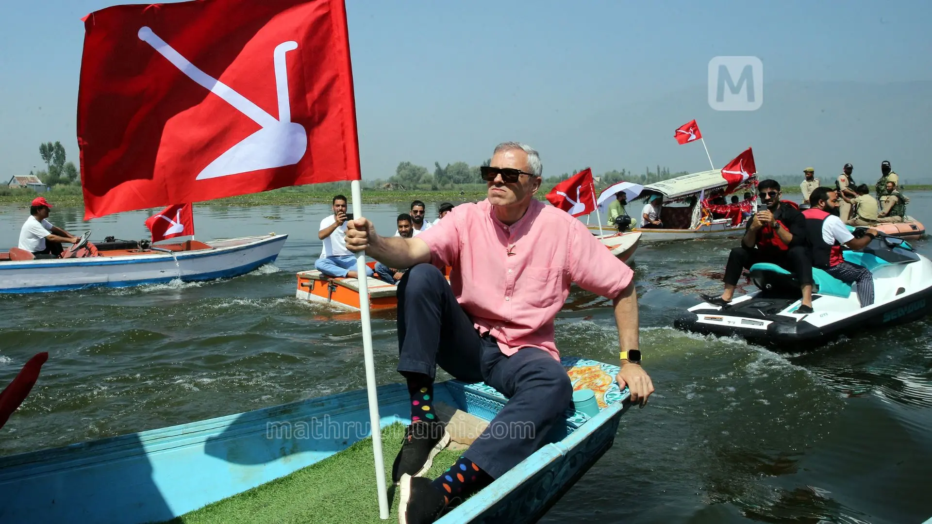 Omar Abdullah, holding the party flag during the Shikara rally