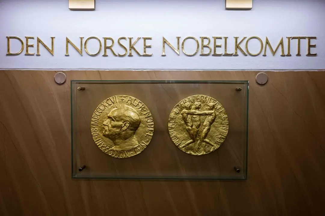 A photo taken on September 25, 2024 in Oslo, Norway shows replicas of the obverse and reverse of the Nobel Peace Prize medal displayed at The Norwegian Nobel Institute.