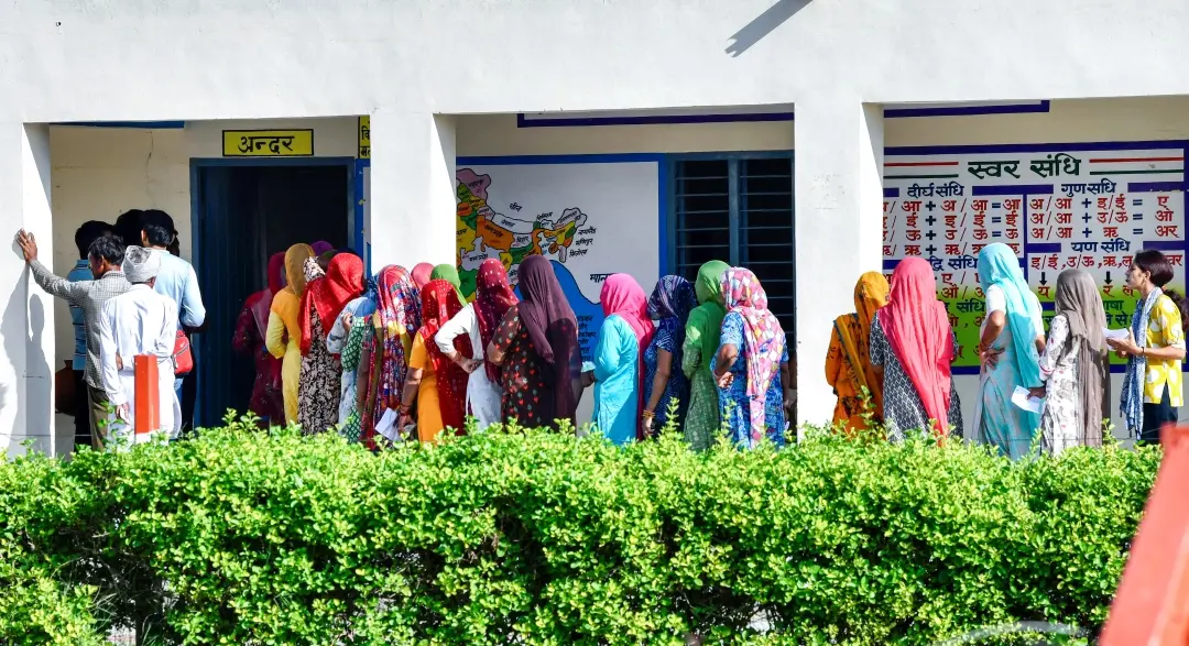 Voters wait in a queue to cast their votes for the Haryana assembly elections | Photo: ANI