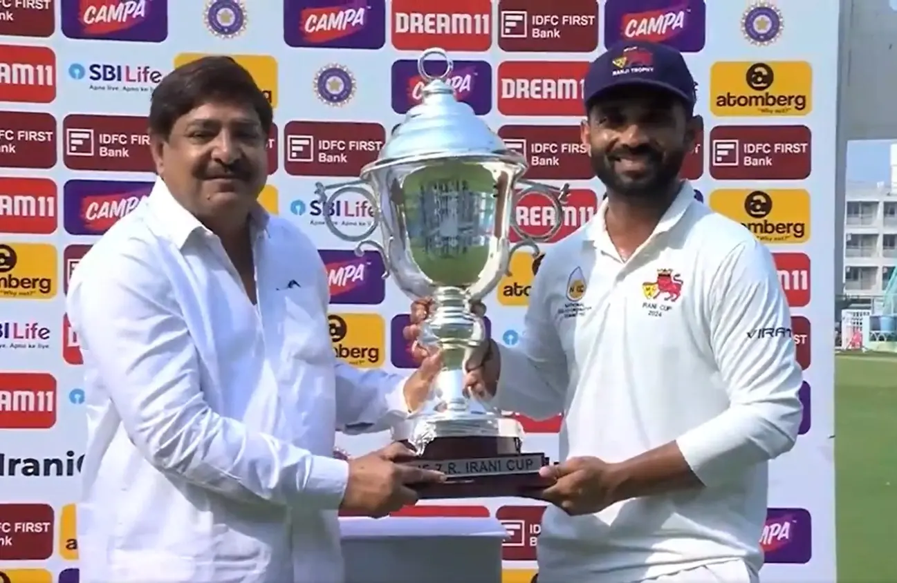 Mumbai skipper Ajinkya Rahane receiving the trophy. | Photo: IANS