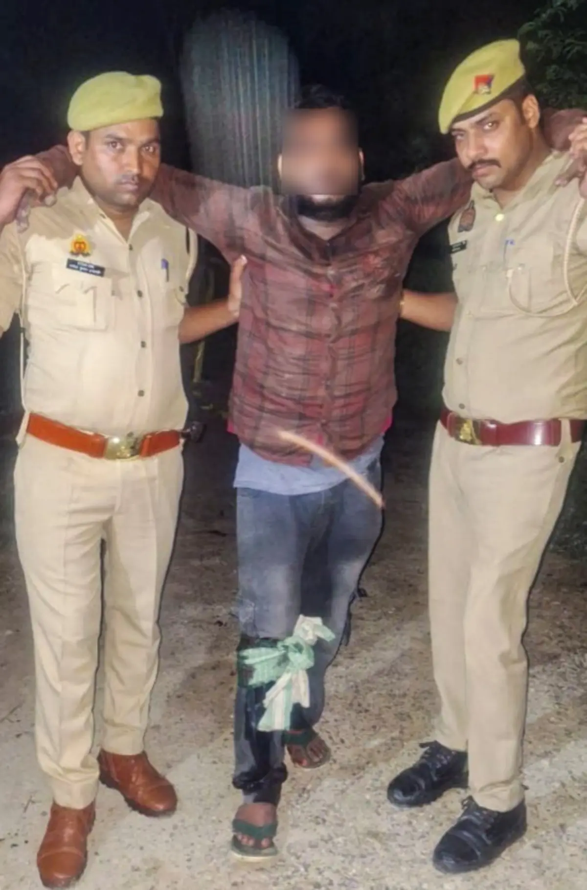 Police take away Chandan Verma after he sustained injuries on his right leg following an encounter with the police early Saturday morning | Photo: PTI