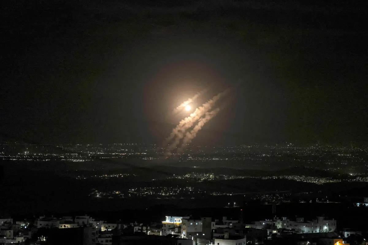 This picture taken from the West Bank city of Hebron shows projectiles above the Israeli city of Ashdod on October 1 | Photo: AFP