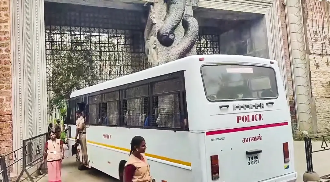 A police convoy enters premises of the Isha Foundation