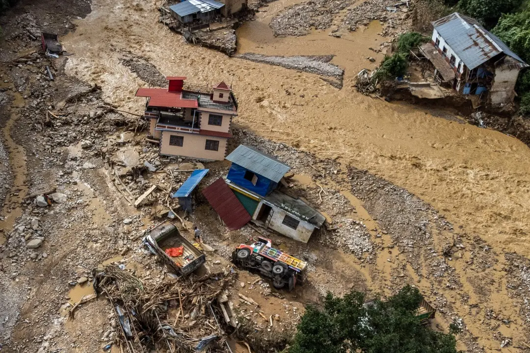 An aerial view shows the area affected by monsoon flooding in Roshi village of Nepal's Kavre district | Photo: AFP