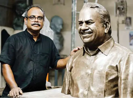 Sculptor N Manoj Kumar besides Kodiyeri's sculpture. | Photo: MBI