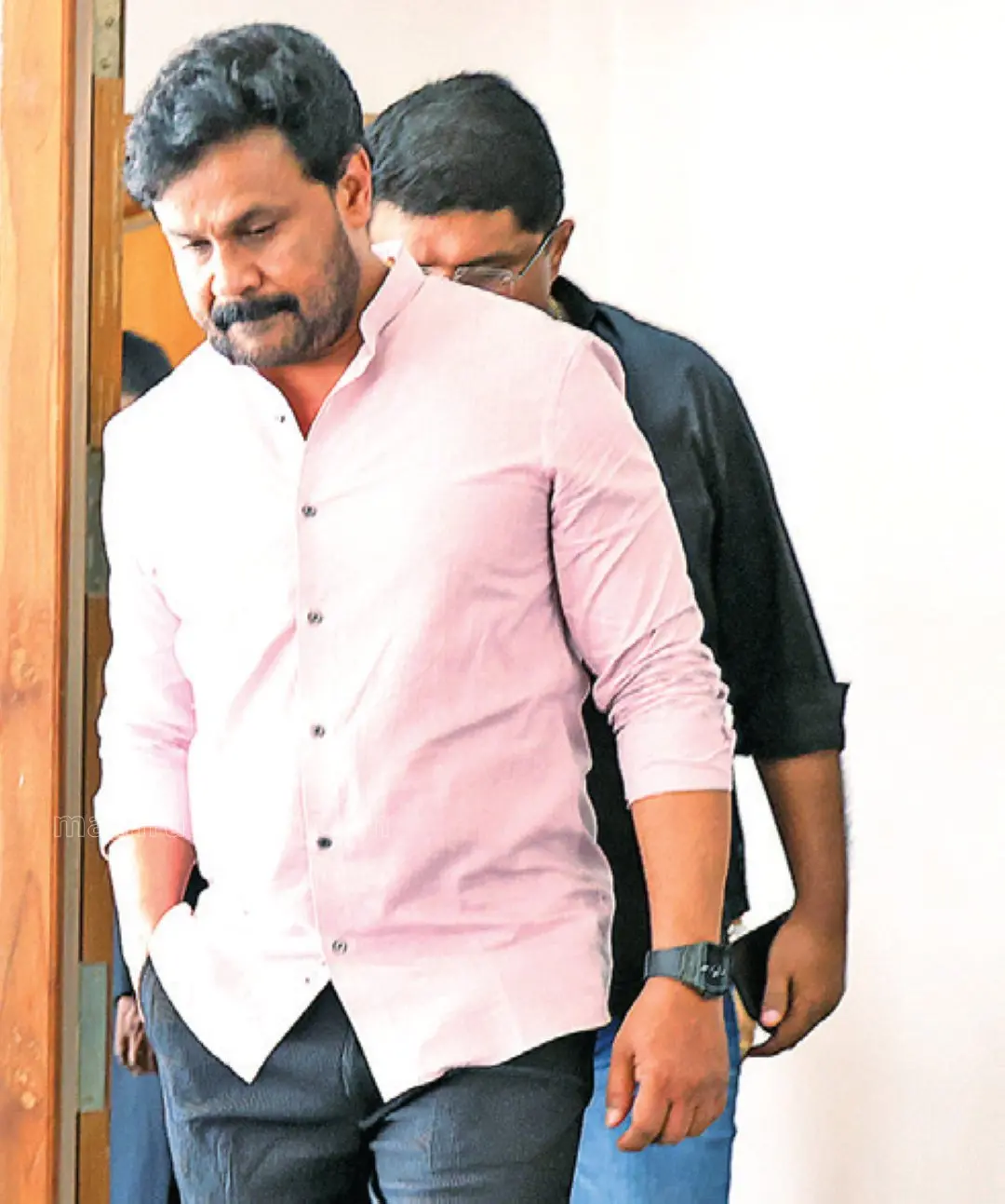 Actor Dileep exits the trial court after appearing in the actress assault case