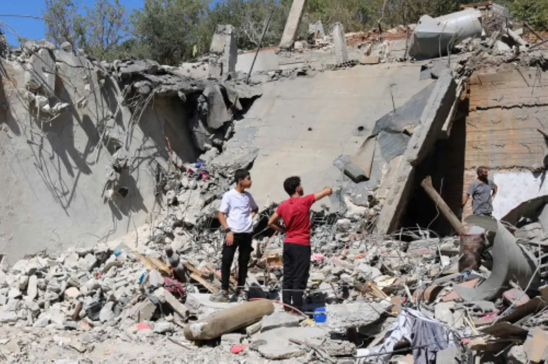 People check the destruction in an area targeted overnight by Israeli airstrikes in el-Karak in Lebanon's Bekaa valley, on Thursday. | Photo: AFP