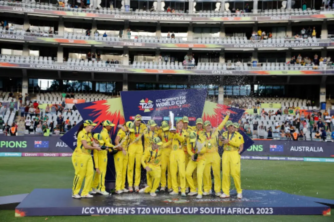 Australia's captain Meg Lanning (C) holds the trophy with her teammates after they won the final T20 women's World Cup cricket match against South Africa at Newlands Stadium in Cape Town in 2023. | File Photo: AFP