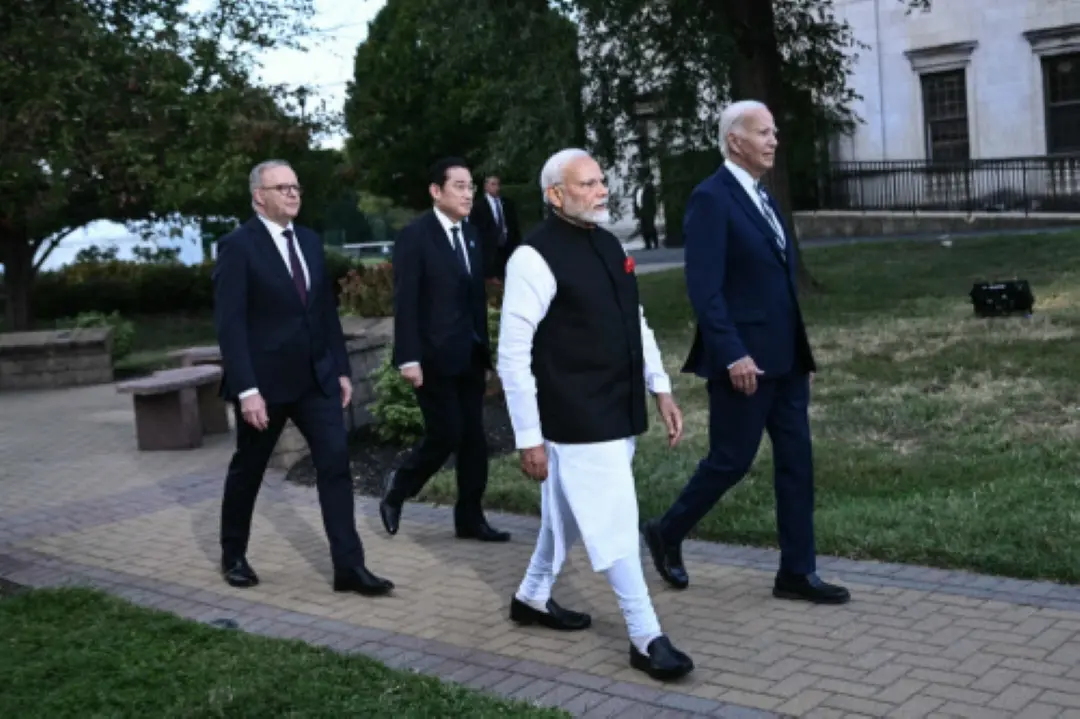 US President Joe Biden (R), alongside Indian Prime Minister Narendra Modi, Australian Prime Minister Anthony Albanese and Japanese Prime Minister Fumio Kishida, arrives to speak about a Quadrilateral Cancer Moonshot announcement during the Quadrilateral Summit at the Archmere Academy in Wilmington, Delaware, on Saturday. | Photo: AFP