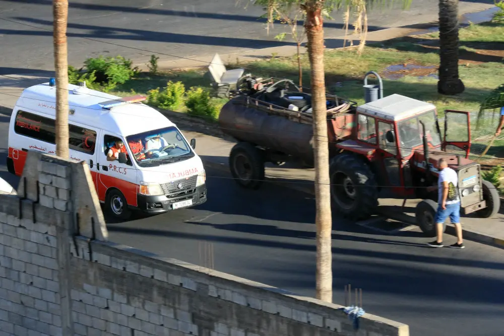 An ambulance rushes wounded people to a hospital in the southern Lebanese city of Saida | AFP
