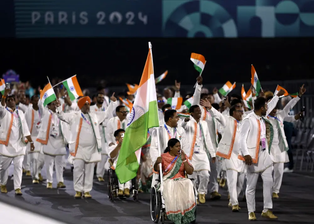 Flagbearers Bhagyashri Mahavrao Jadhav of India and Sumit of India lead their contingent during the Opening Ceremony for the 2024 Paralympics | AP