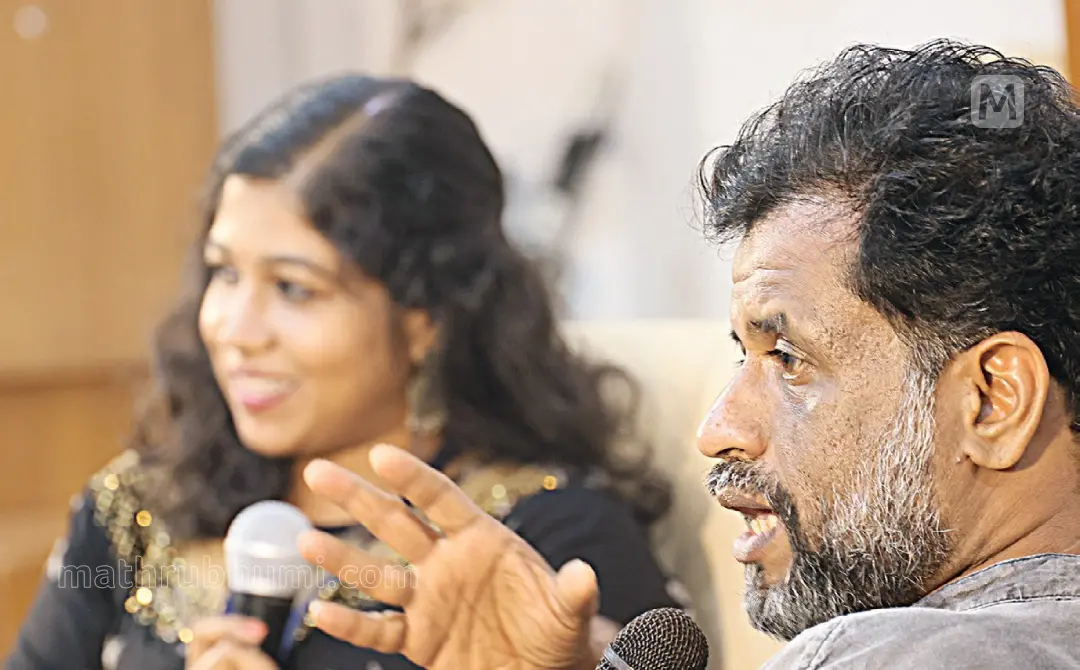 Geo Baby speaking at a seminar in Kannur. Moderator Sindhoori Vijayan is also seen. Photo: Mathrubhumi
