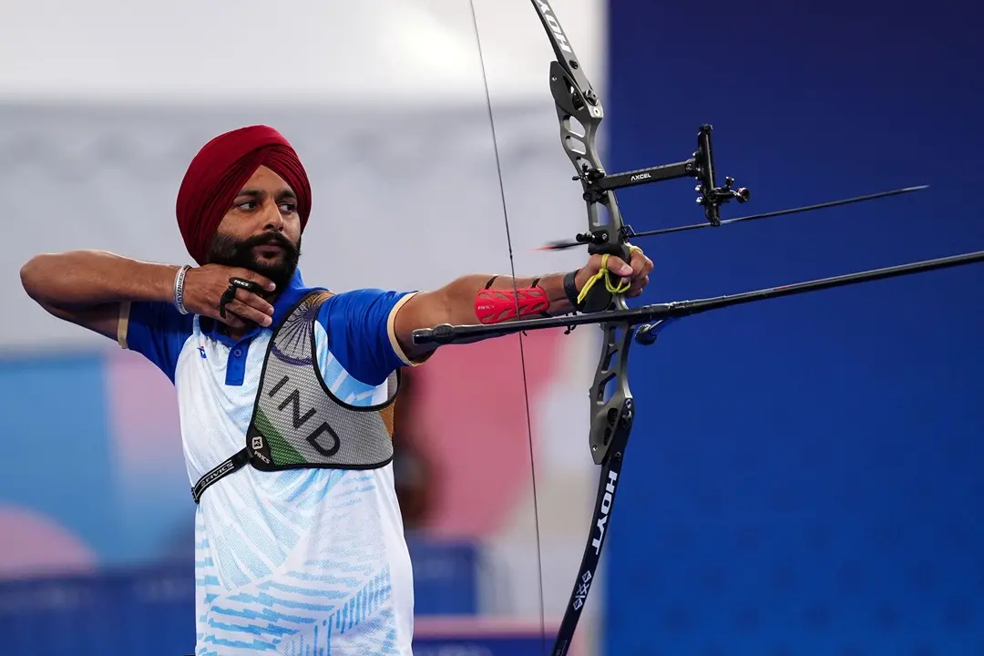 India's Harvinder Singh competes during the archery Men's individual recurve open Gold Medal match during the Paris 2024 Paralympic Games at the Esplanade des Invalides, in Paris | Photo: AFP