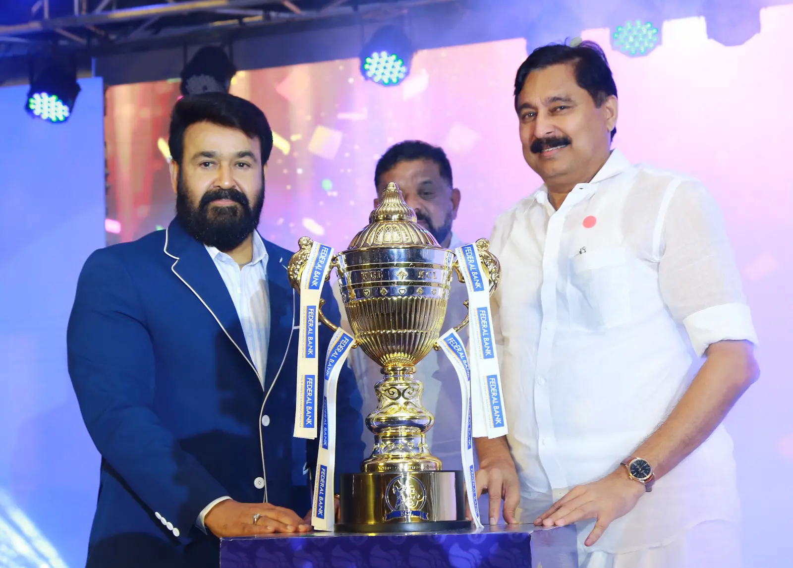 Actor Mohanlal and Kerala Sports Minister V V. Abdurahiman unveiling the winners' trophy of the Kerala Cricket League (KCL).