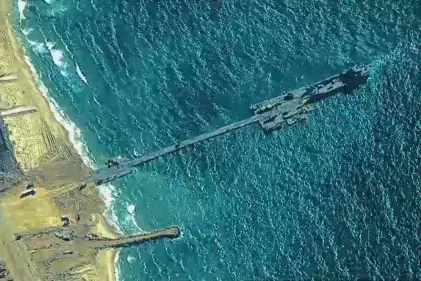 First aid shipment driven across newly built US pier into Gaza Strip