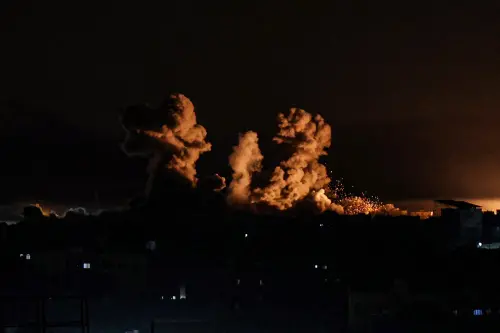 This photograph taken from Rafah, shows smoke billowing during Israeli bombardment over Khan Yunis in the southern Gaza Strip, amid ongoing battles between Israel and the Palestinian militant group Hamas. (Photo by AFP)