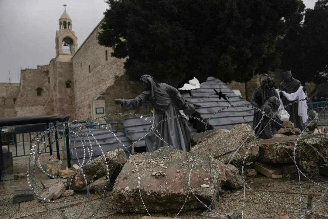 A nativity scene decorated to honor the victims in Gaza is displayed in Manger Square, near the Nativity Church, which is traditionally believed to be the birthplace of Jesus, on Christmas Eve