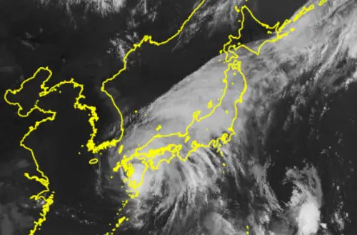 Japan Meteorological Agency's satellite 'Himawari' on August 29, 2024 shows Typhoon Shanshan (botom, L) moving on Japan's Kyushu region