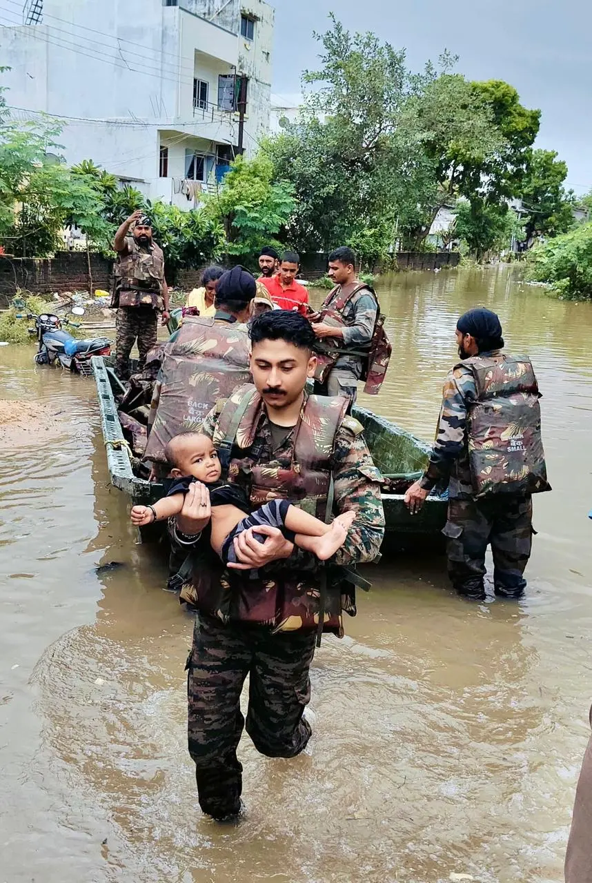 Indian Army personnel with a kid