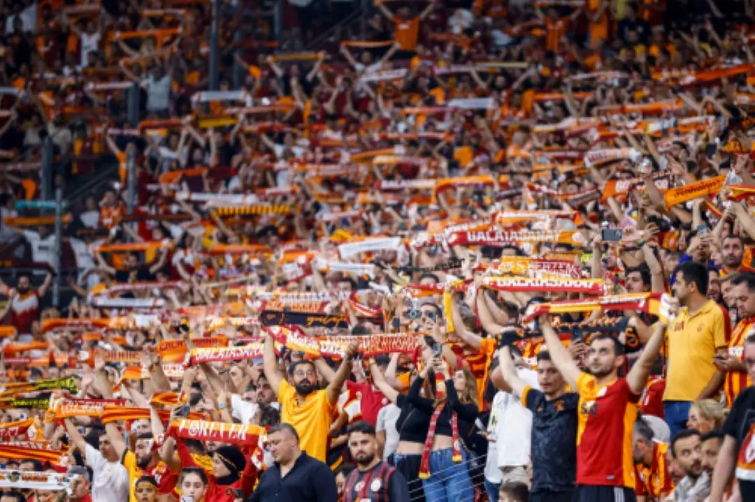 Galatasaray's fans cheer on their team during the Champions League second leg play off football match between Galatasaray and Young Boys at the Rams Park stadium in Istanbul. | Photo: AFP
