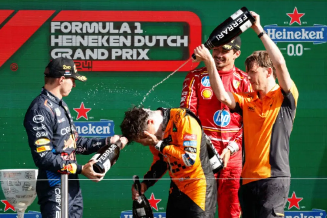 Winner McLaren's British driver Lando Norris (Bottom-L) and second-placed Red Bull Racing's Dutch driver Max Verstappen (L) third-placed Ferrari's Monegasque driver Charles Leclerc (2nd R) during the podium ceremony after the Formula One Dutch Grand Prix at The Circuit Zandvoort, western Netherlands. | Photo: AFP