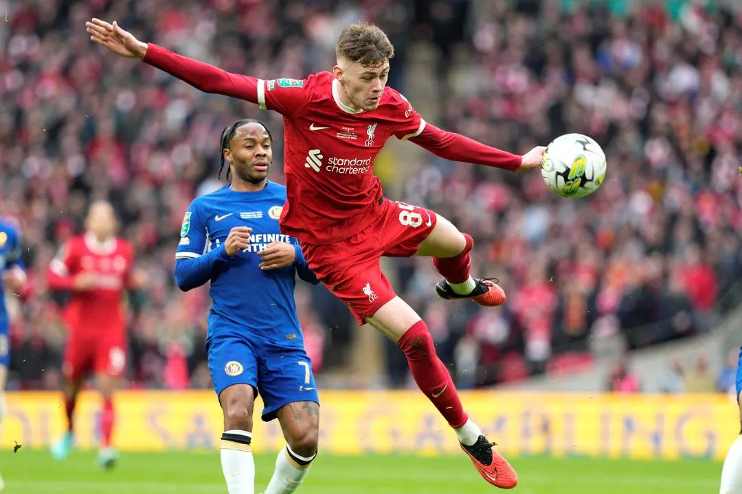 Liverpool's Conor Bradley, front, controls the ball during the English League Cup final soccer match between Chelsea and Liverpool. | File Photo: AP