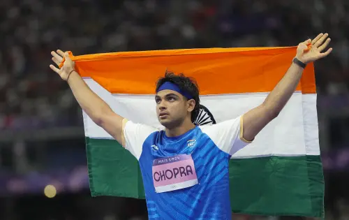 India's Neeraj Chopra celebrates after winning the silver medal in the men's javelin throw athletics event at the 2024 Summer Olympics, in Paris, France. | Photo: PTI