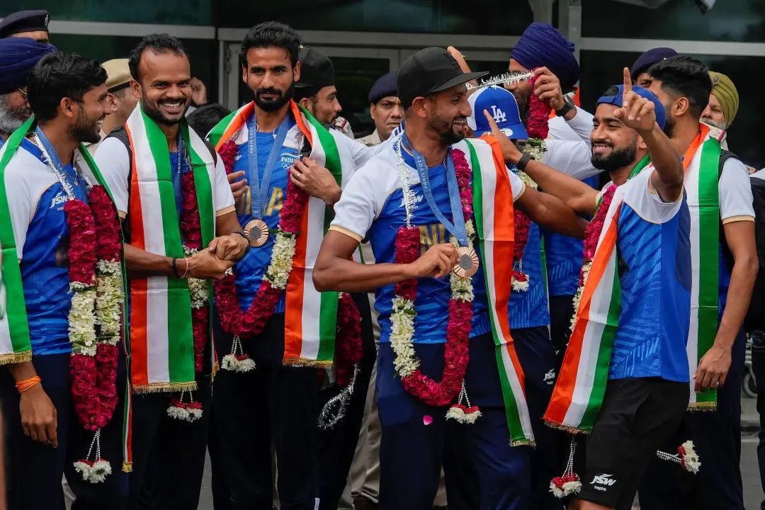 Paris Olympic Bronze medalist Indian Hockey players on their arrival at the Indira Gandhi International Airport, in New Delhi
