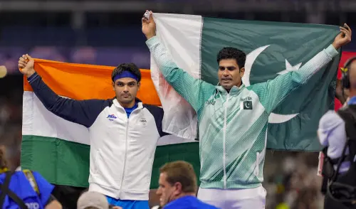 Silver medallist India's Neeraj Chopra and Gold medallist Pakistan's Arshad Nadeem celebrate after the men's javelin throw final at the 2024 Summer Olympics, in Paris, France. | Photo: PTI