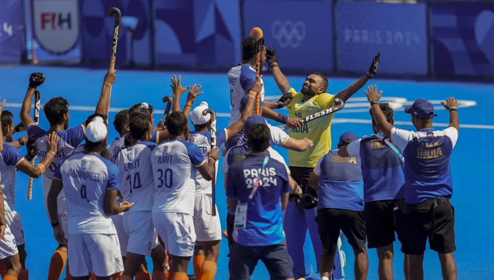 India's goalkeeper PR Sreejesh celebrates with teammates after India won the men's hockey bronze medal match against Spain | PTI