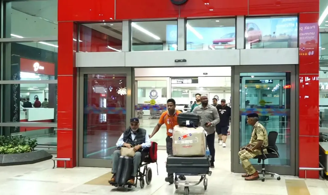Passengers come out after the Air India flight from Dhaka arrived at the airport in New Delhi | Photo: PTI