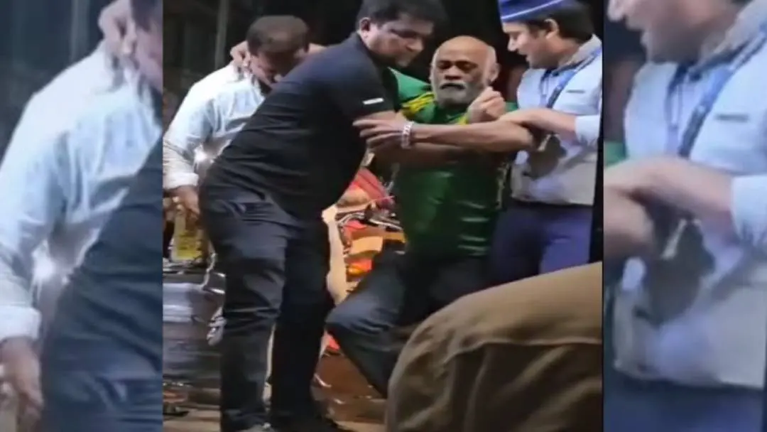 People helping Vinod Kambli who finds it difficult to even walk. | Photo: X