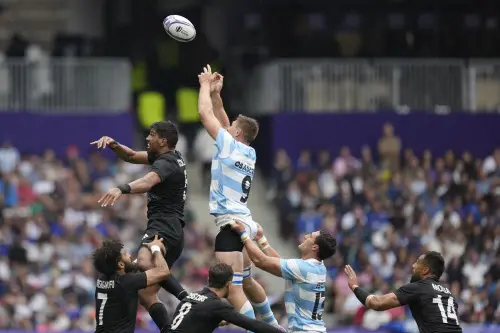 Argentina's Matias Osadczuk, top right, attempts to collect the ball in a line out during the men's Placing 5-8 Rugby Sevens match between New Zealand and Argentina at the 2024 Summer Olympics. | Photo: AP