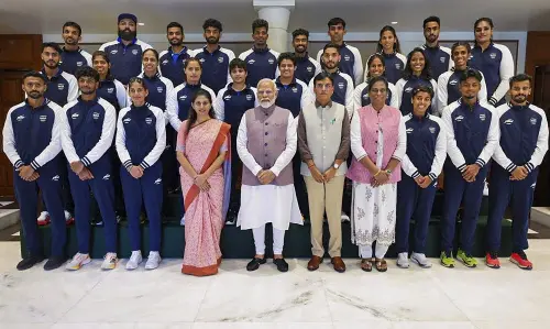 New Delhi: Prime Minister Narendra Modi with Union Minister of Youth Affairs and Sports Mansukh Mandaviya and Indian Olympic Association President PT Usha poses for a group photo with the Indian contingent heading for the upcoming Paris Olympics. | File Photo: PTI