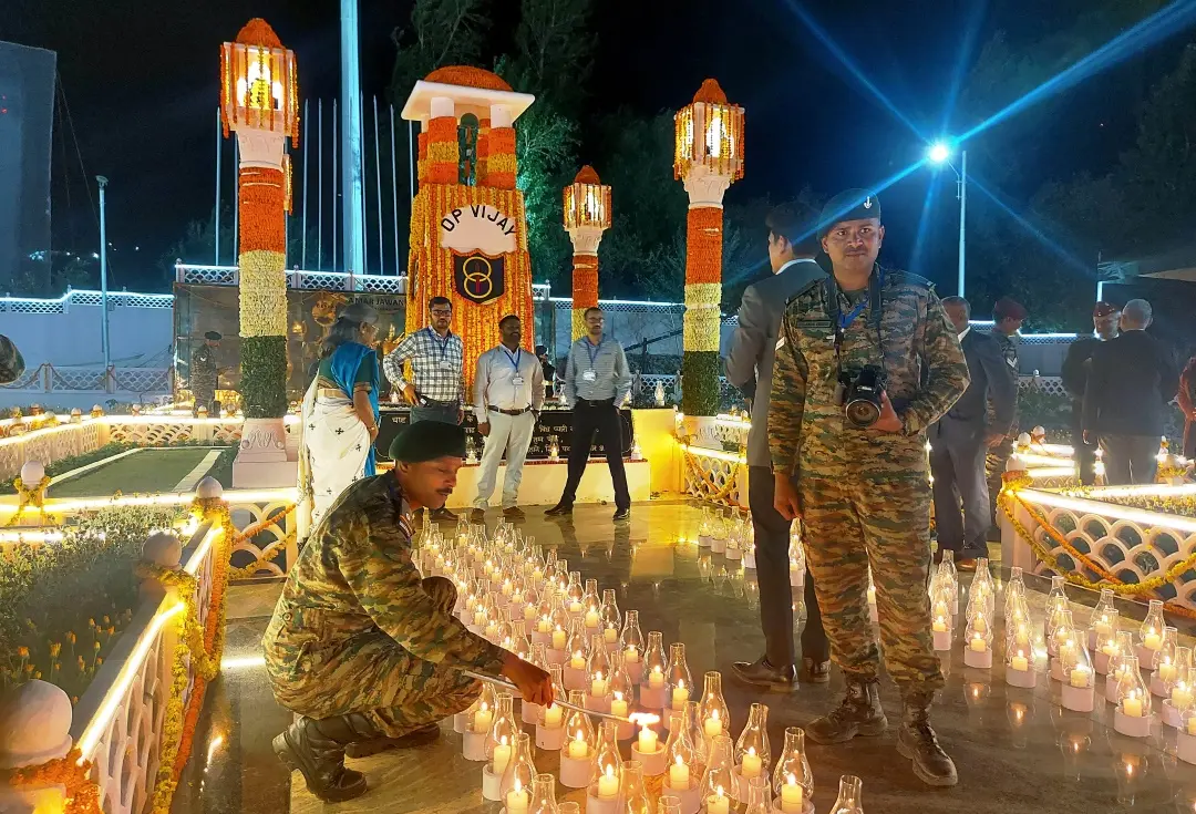 Army personnel light candles and pay tribute at the Drass War Memorial during 'Shaurya Sandhya', organised to commemorate the 545 martyrs of Kargil war, on the eve of 25th Kargil Vijay Diwas celebrations