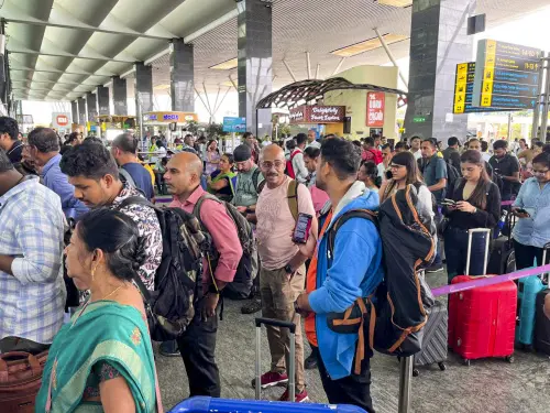 Stranded passengers wait in queues amid the Microsoft outage, at the Kempegowda International Airport in Bengaluru on Friday. | Photo: PTI