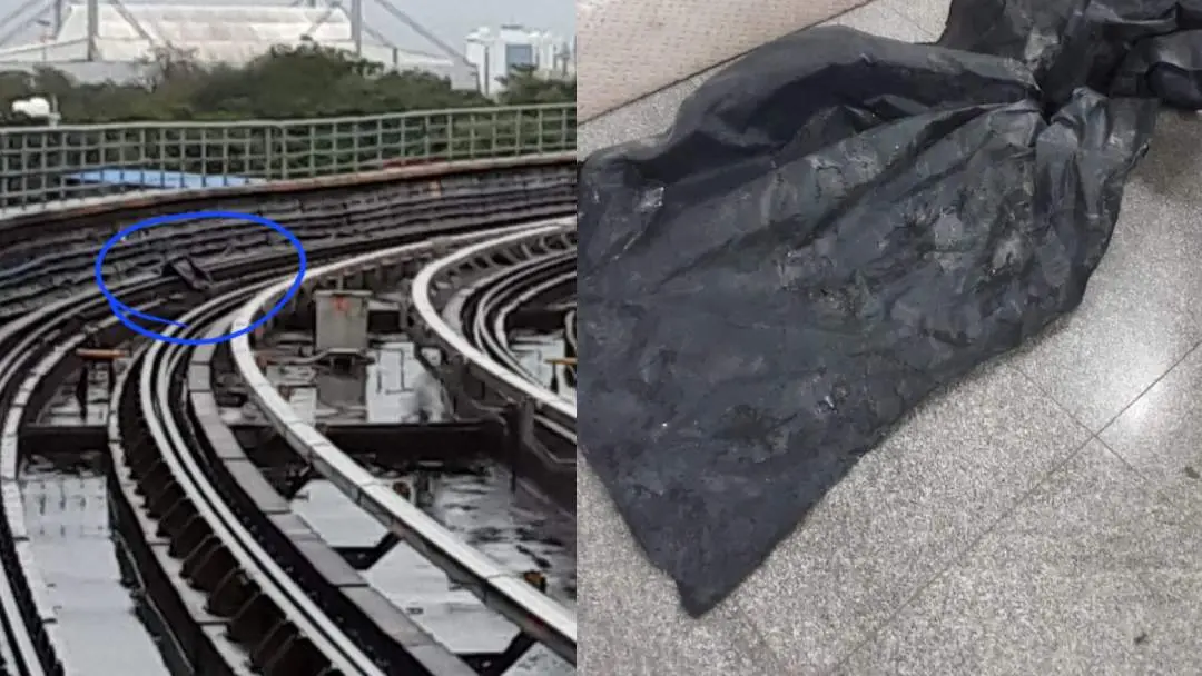 The tarpaulin sheet that fell on the tracks of Kochi metro