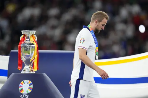 England's Harry Kane walks past the trophy after the final match between Spain and England at the Euro 2024 soccer tournament in Berlin, Germany | Photo: AP
