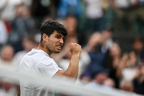 Spain's Carlos Alcaraz celebrates winning against Australia's Aleksander Vukic during their men's singles second round tennis match on the third day of the 2024 Wimbledon Championships at The All England Lawn Tennis and Croquet Club in Wimbledon, southwest London | Photo: AFP