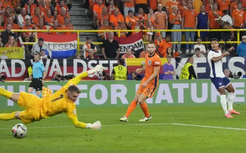 England's Ollie Watkins, right, scores his side's decisive second goal against Netherlands goalkeeper Bart Verbruggen during a semifinal match between the Netherlands and England at the Euro 2024 soccer tournament in Dortmund, Germany | Photo: AP