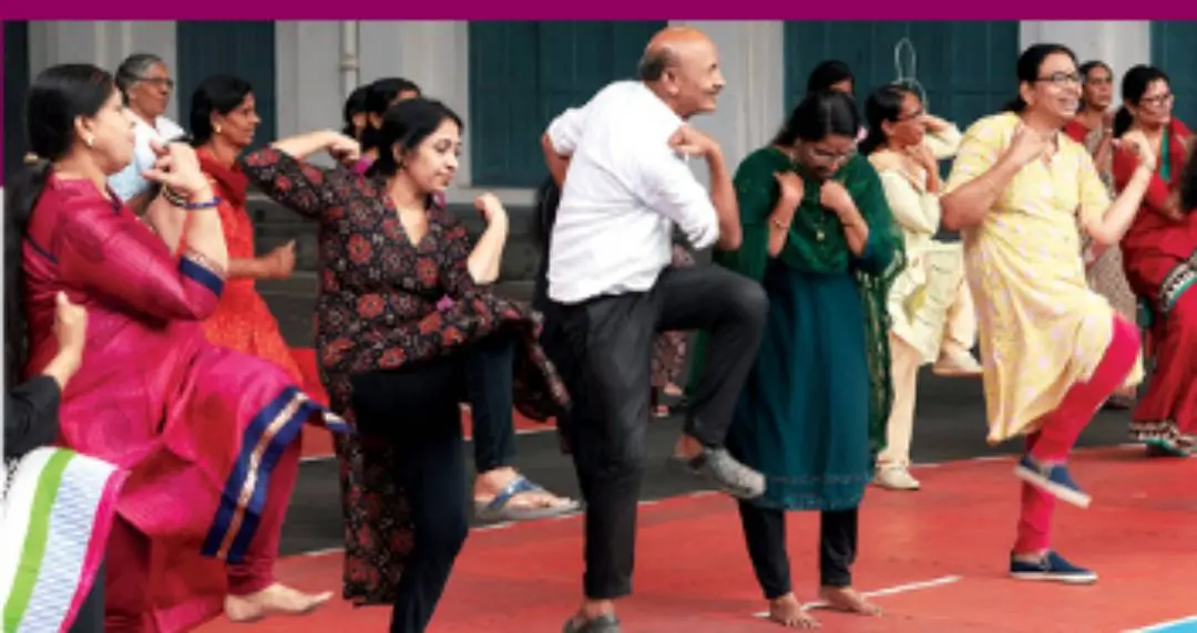 Member of SH College's age-friendly club taking part in Zumba dance