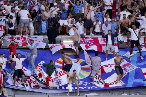 England fans celebrate at the end of a quarterfinal match between England and Switzerland at the Euro 2024 soccer tournament in Duesseldorf, Germany, on Saturday | Photo: AP/PTI