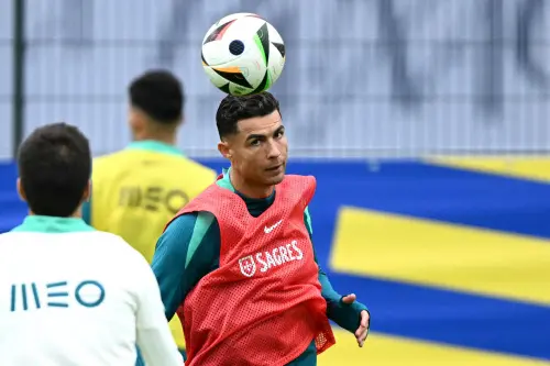 Cristiano Ronaldo takes part in a training session at the team's base camp in Harsewinkel | Photo: AFP