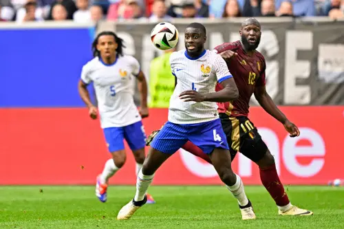 (From L) France's defender #04 Dayot Upamecano controls the ball next to Belgium's forward #10 Romelu Lukaku during the UEFA Euro 2024 round of 16 football match between France and Belgium at the Duesseldorf Arena in Duesseldorf | Photo: AFP