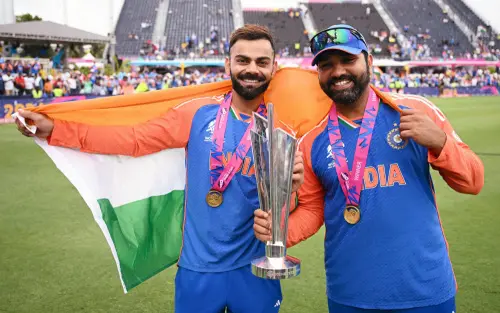 India's captain Rohit Sharma and Virat Kohli pose for a picture with the trophy after Team India wins the ICC Mens T20 World Cup 2024 final match against South Africa, at Kensington Oval in Barbados on Saturday. (ANI Photo)