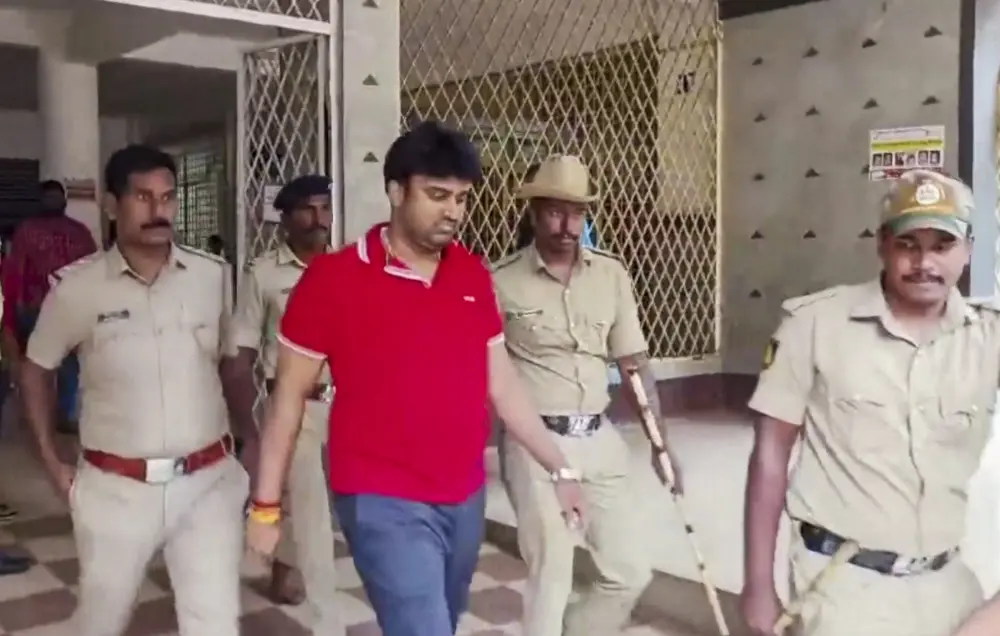 Suraj Revanna, arrested for allegedly sexually abusing a party worker, being taken to custody after his medical check-up | PTI