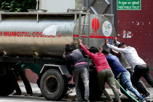 Delhi continues to grapple with water crisis; long queues seen at water tankers