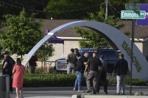 Officials with the Oakland County Sheriff's Department, Rochester Hills Fire Department and other jurisdictions secure the scene of a shooting at the Brooklands Plaza Splash in Rochester Hills. l Photo: AP