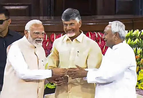 Senior BJP leader Narendra Modi with TDP chief N. Chandrababu Naidu and Bihar CM and JD(U) leader Nitish Kumar during the NDA parliamentary party meeting at Samvidhan Sadan, in New Delhi. l Photo: PTI